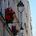 Carriage lamps and red geraniums