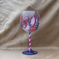 http://www.bybecca.com/birthday-glass-with-floral-design/ Hot Pink Navy and coral print on hand painted wine glass makes great 50th birthday gift