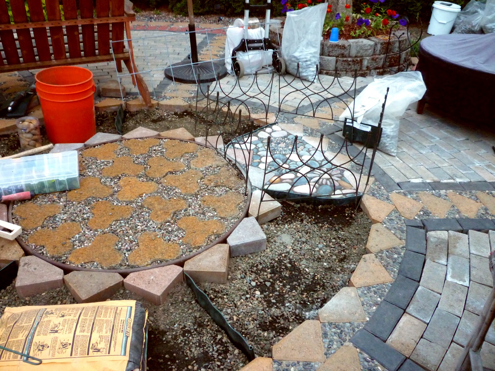 Wow, thats a busy Garden! Creating A Paver and Pebble Mosaic Patio