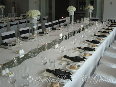 Our gorgeous designer chair covers in white with the black band diamante