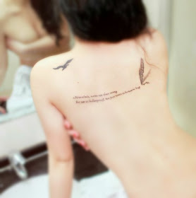 flying goose tattoo on the back with letters