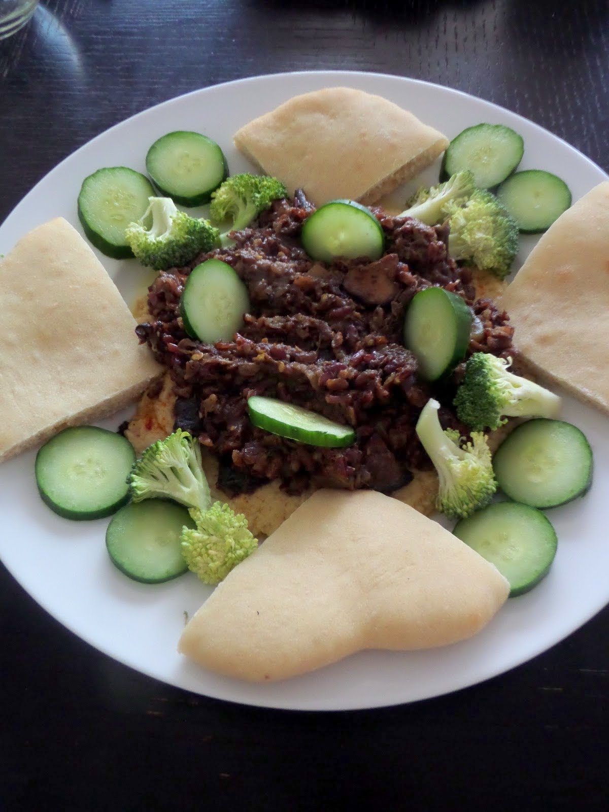 Spiced Eggplant and Mushrooms:  Eggplant, mushrooms, and rice cooked in Mediterranean spices and served over hummus.  A delicious, flavorful, and filling vegetarian one pot meal.