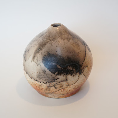 Horsehair and feather raku pottery vase by Lily.