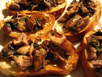 Wild Mushroom Tapas Served on Crusty Bread amongst Goat Cheese