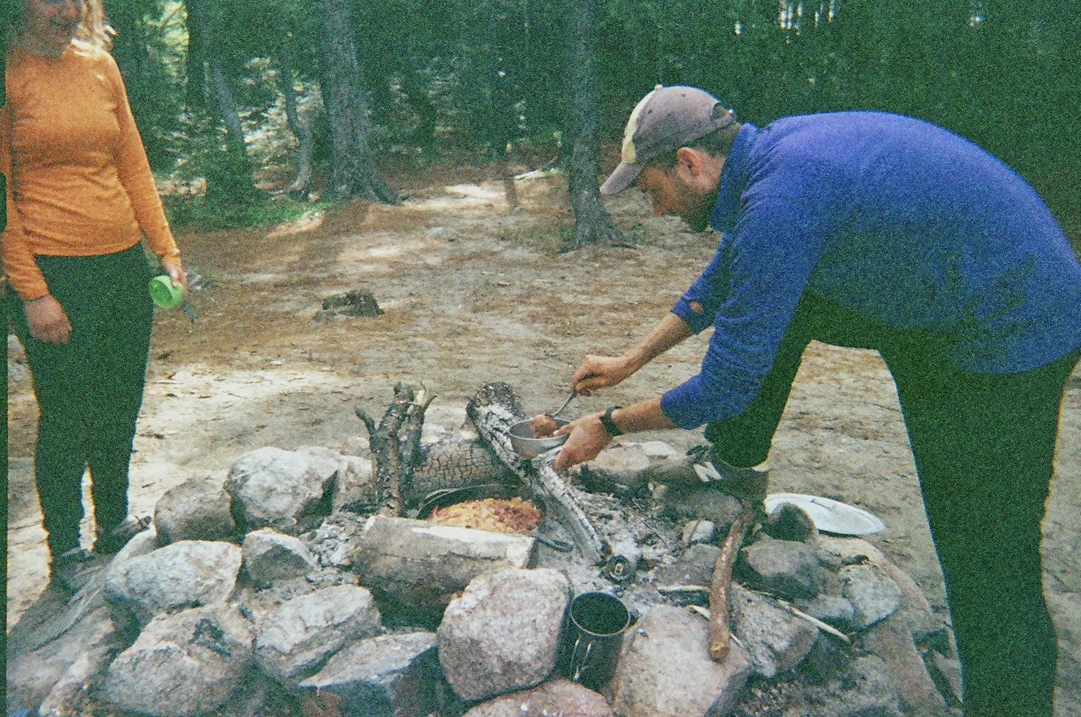 Dishing out Campfire Skillet Cobbler