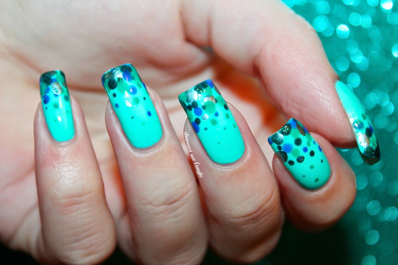 A mermaid french manicure made with a dotting tool