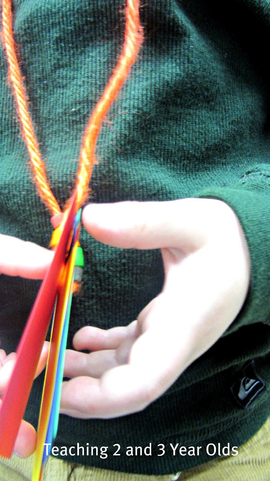 Teaching 2 and 3 Year Olds Rainbow Threading Necklaces