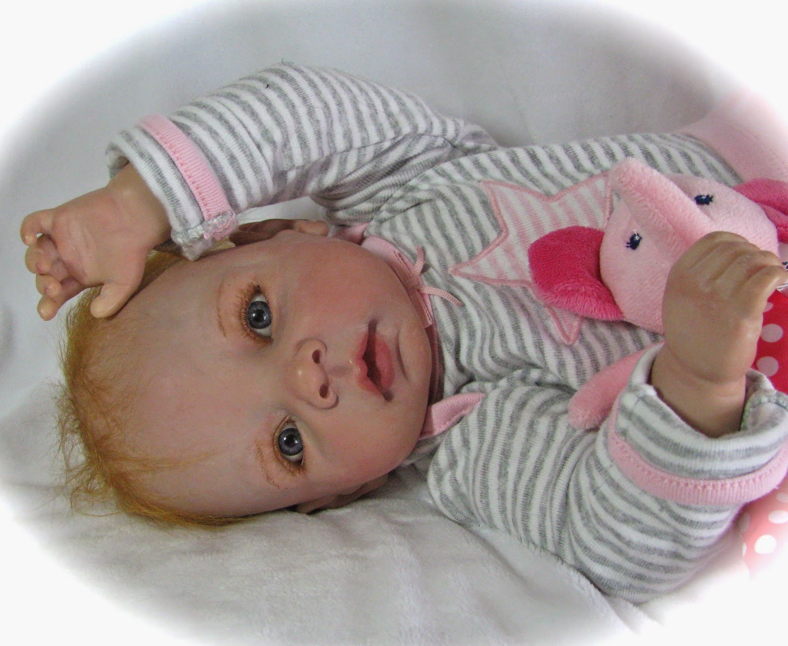 baby doll with red hair and blue eyes