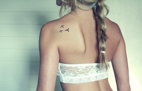 3. Small Feather Tattoos for Ladies - wide 3