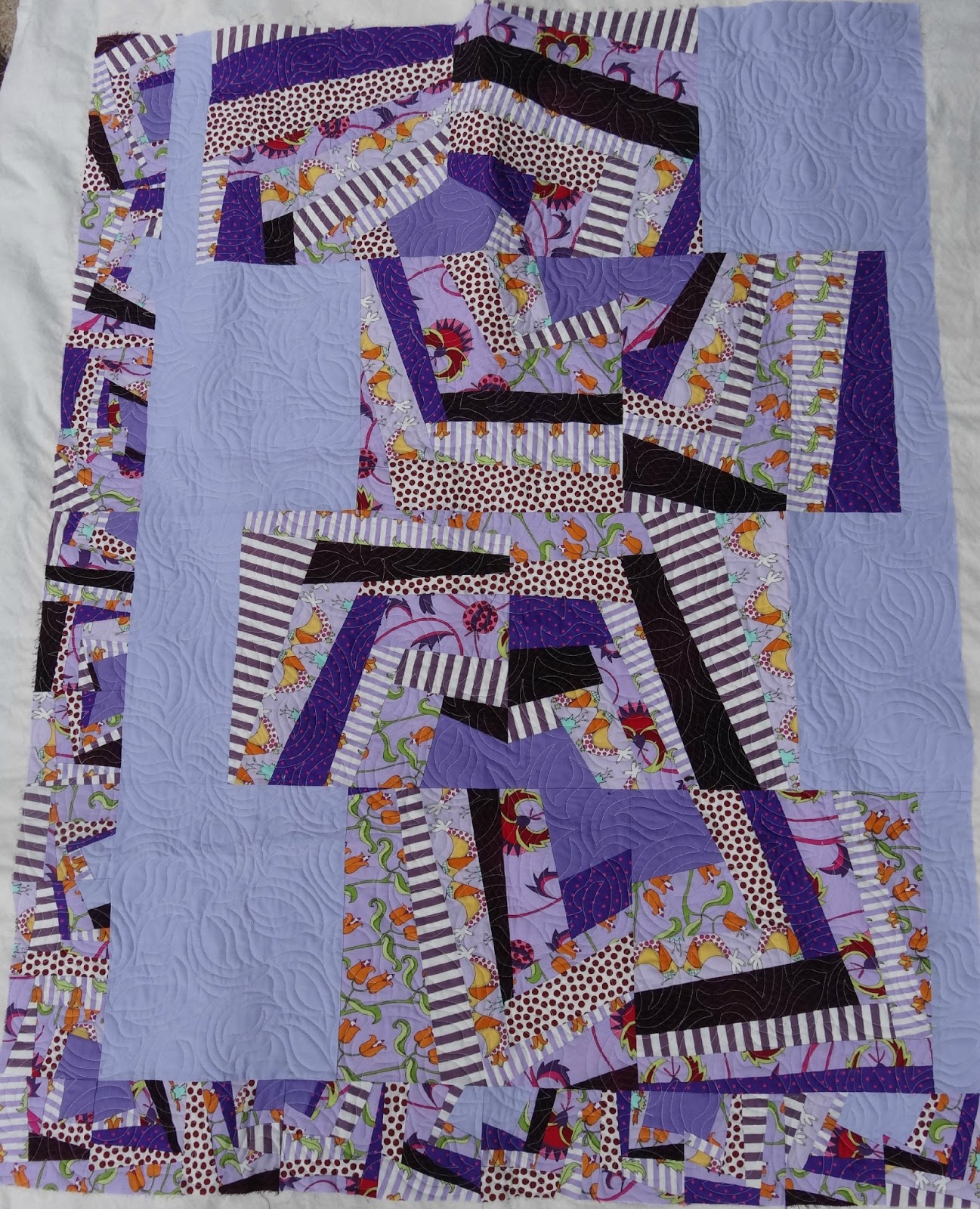 quilts ioff white quiltsth pruple in them