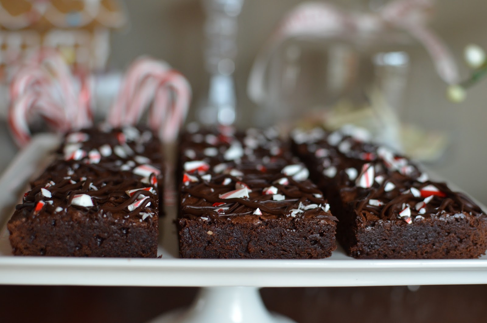 Playing with Flour Peppermint brownies topped with candy cane and dark