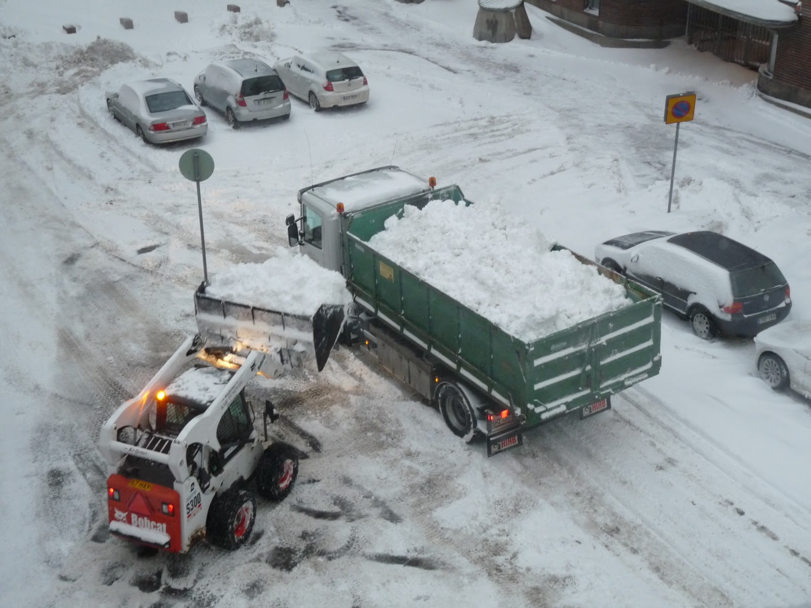 Eventually a truck comes to pick up all the piles of snow!