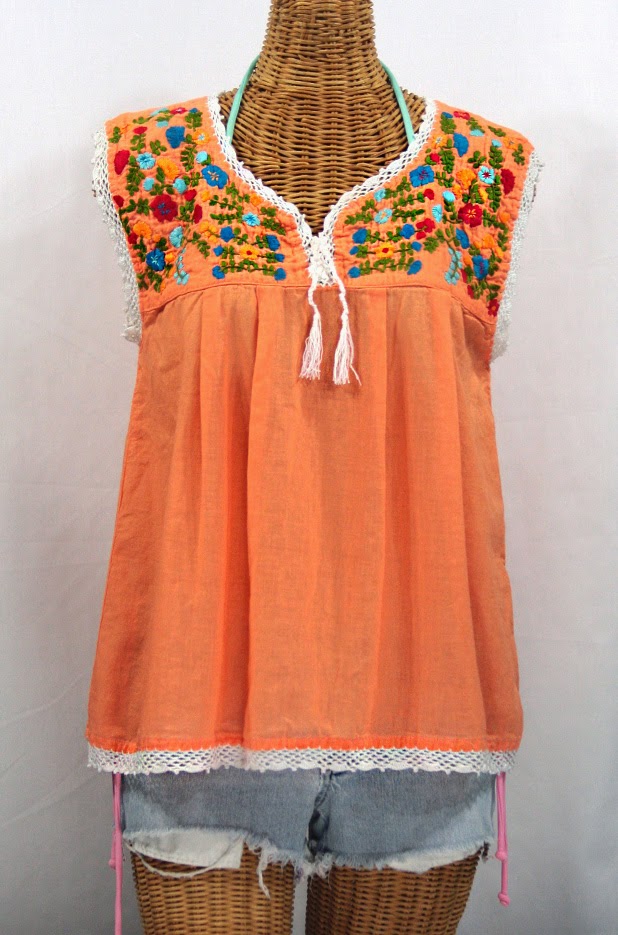 http://www.sirensirensiren.com/shop/new!-embroidered-peasant-tops/marbrisa-sleeveless-peasant-blouse/embroidered-sleeveless-mexican-blouse-marbrisa-orange-cream