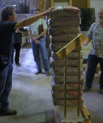 Craftsmen at Seattle Stair & Design use ballistic specialist to test glass treads for new staircase