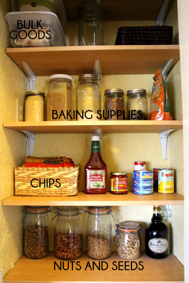 Organizing pantry shelves with jars and baskets