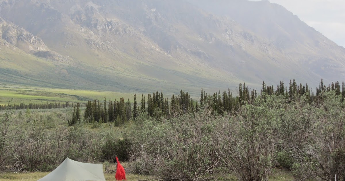 Brooks Range gear reflections on stove and footwear