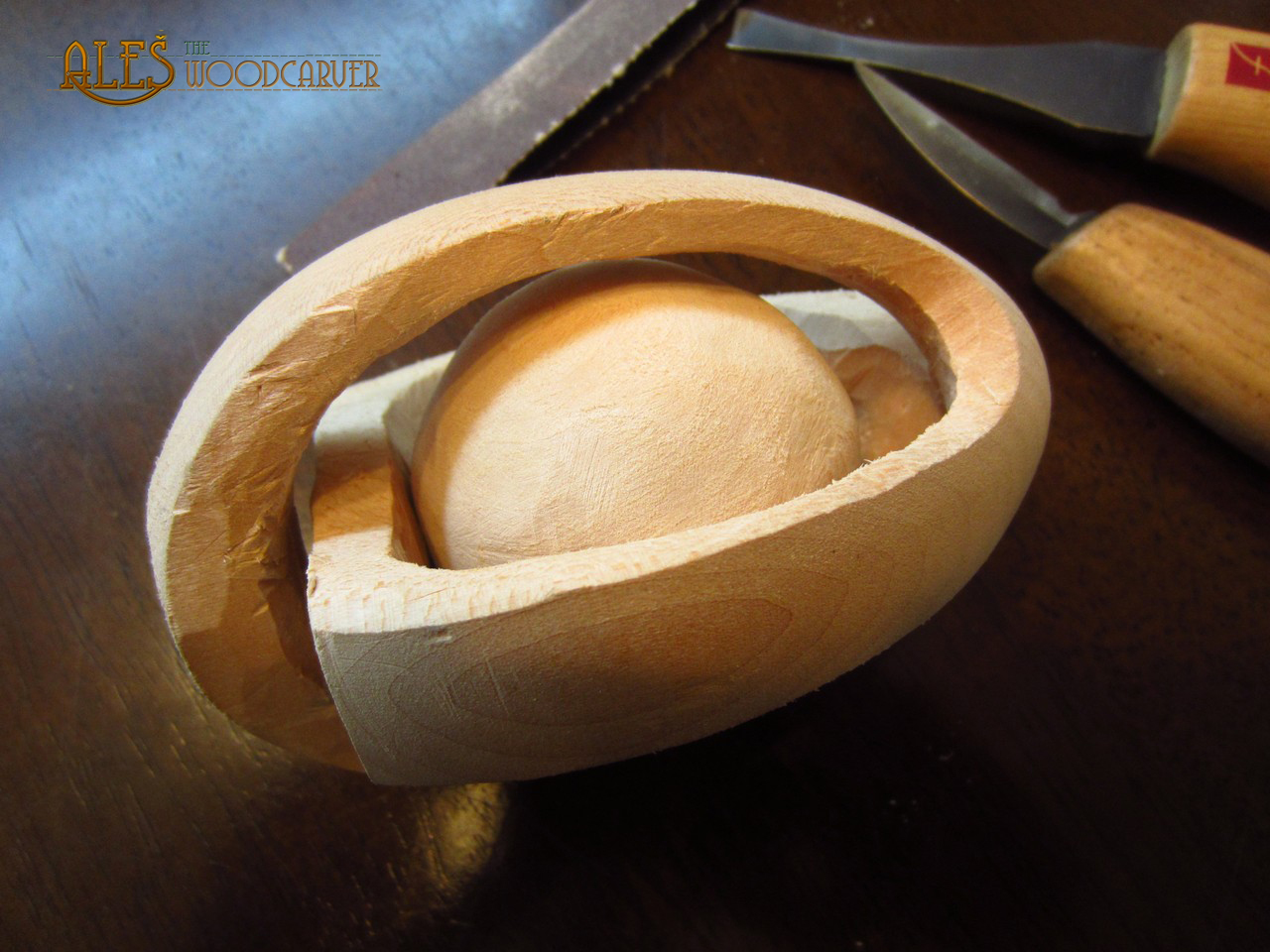 Ales the woodcarver Ball in a cage