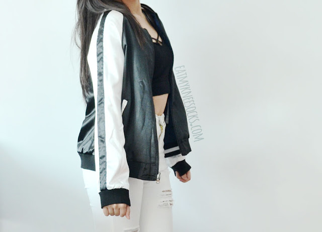 SheIn Fashion Review: Reversible Embroidered Bomber Jacket A sporty-chic outfit featuring SheIn's reversible silk satin embroidered Asian-style bomber baseball jacket, paired with white ripped destroyed high-waisted skinny jeans, blue velvet Report high-heeled booties, and a Brandy Melville-inspired cross-front cropped tank top.