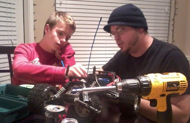 Tommy and Tom working on a remote