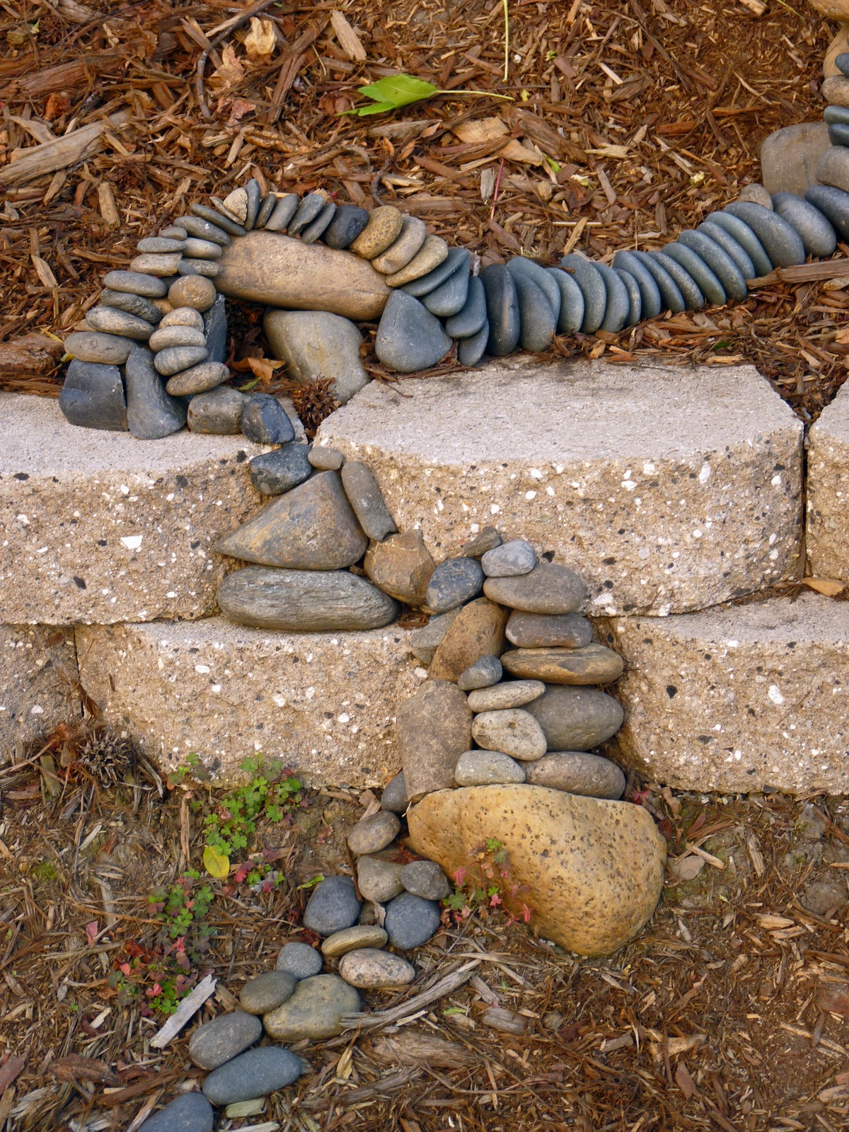 The Blue Elephant Stacking Rocks
