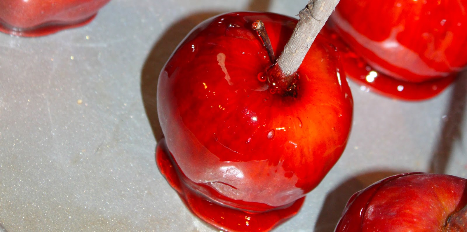 love is in the details Candied apples on a stick.