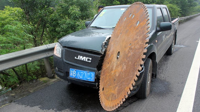 Chinese Man Escapes Unhurt After Huge Saw Blade Slices Truck Chinese Man Escapes Unhurt After Huge Saw Blade Slices Truck