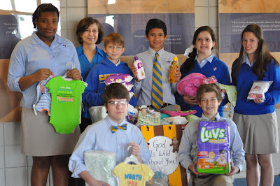 Montgomery Catholic Middle School Students Make Donation to COPE 1