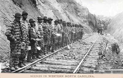 chaingang posing with railroad track they build