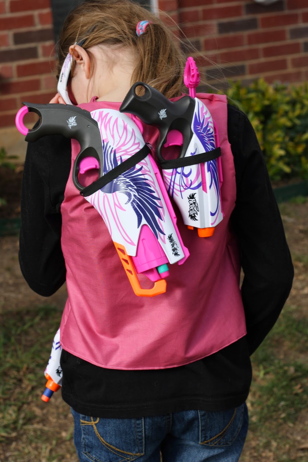 I also made some elastic holders for her guns on the back of the vest, and another one on the