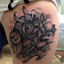 Angry black owl tattoo on side body