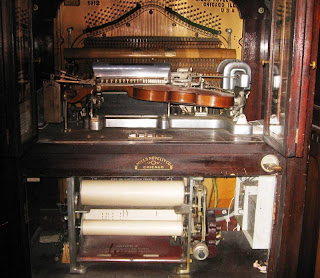 Automatic piano and violin-playing instrument