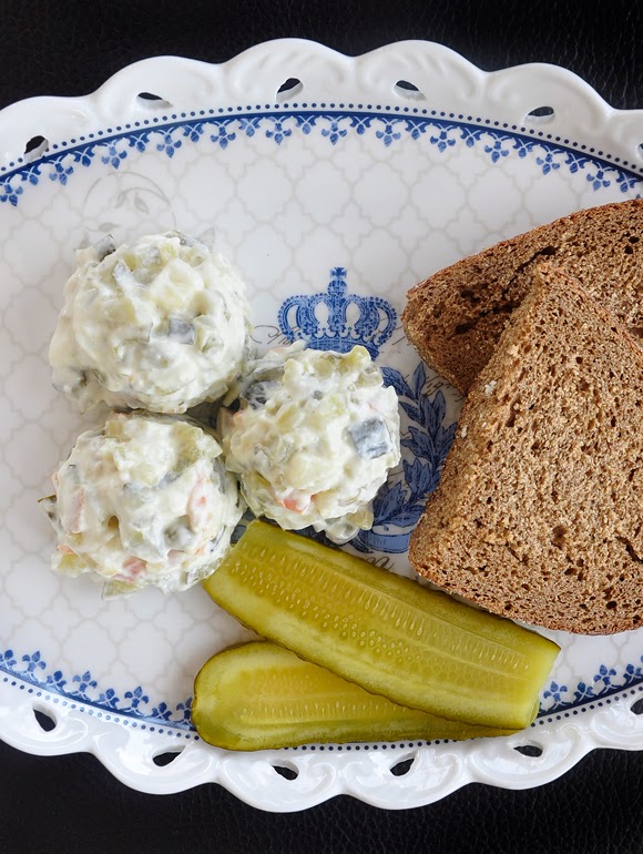Russian salad with some slices bread