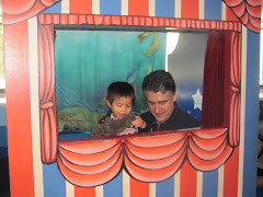 Alexandre and Dad doing a puppet show