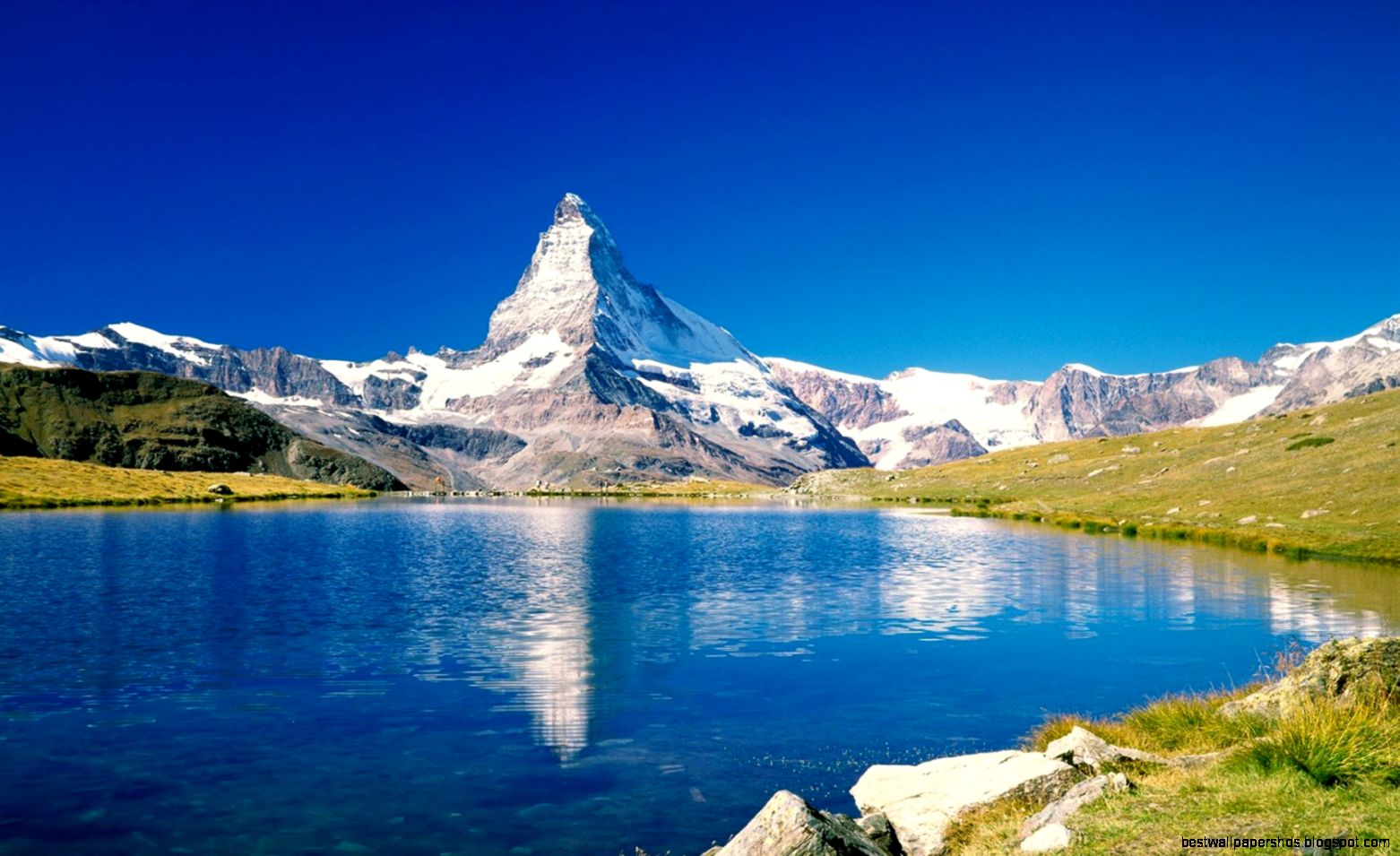Blue lake and mountain scenery Wallpaper 1680x1050 resolution Blue lake and mountain scenery Wallpaper 1680x1050 resolution