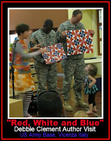 photo of: Author Illustrator Visit to US Army Base in Italy, Comparing original Quilt to Finished Book