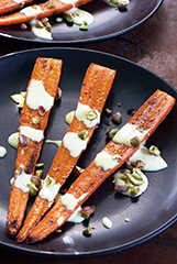 Carrot Steaks w/ Roasted Garlic & Lemon Hollandaise Sauce and Toasted Pistachio Garnish