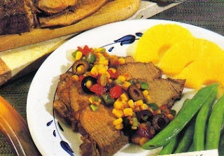 Picture of Holiday Steak Sauce Corn on a white plate with some peaches and green beans 