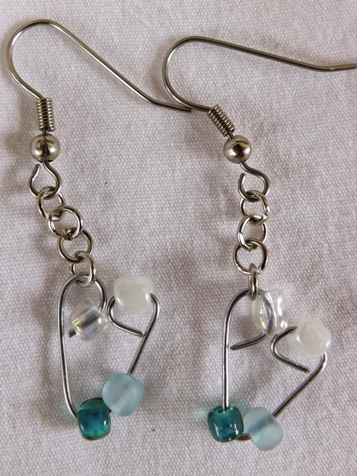 http://www.ebay.com/itm/Single-Heart-Earrings-Handmade-glass-dangle-with-stainless-steel-hook-/261770359867?fb_action_ids=318221801699656&fb_action_types=og.shares