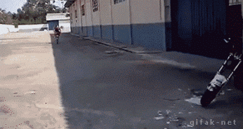 motorbike rider does wheelie into parking space funny skills parking win outside warehouse car park