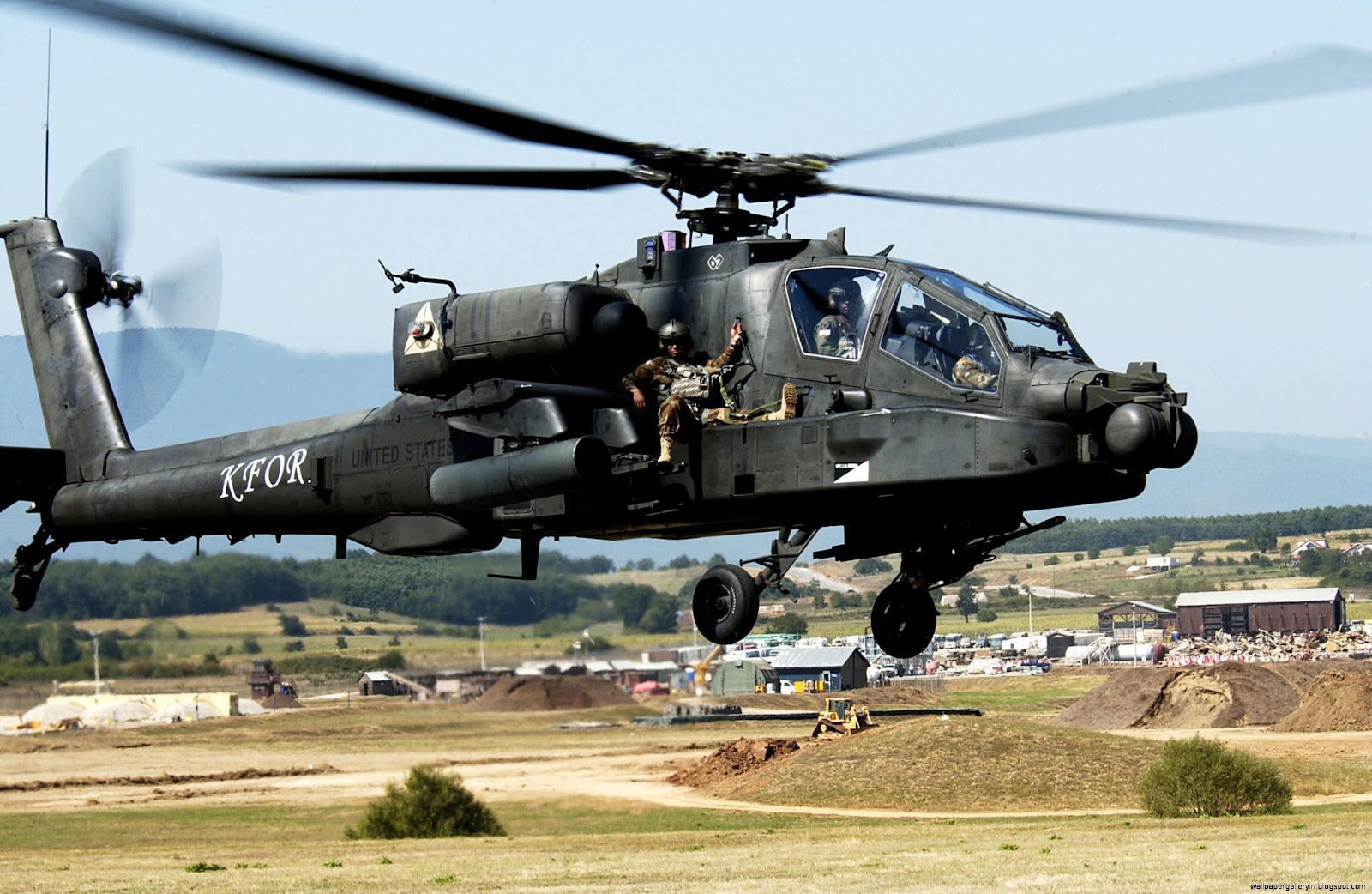 Soldiers Riding On Apache Helicopter Soldiers Riding On Apache Helicopter