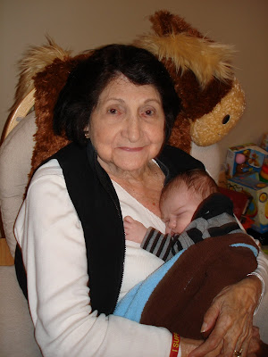 Here's Black Granny with my newborn snugglebug in his I'm going to meet