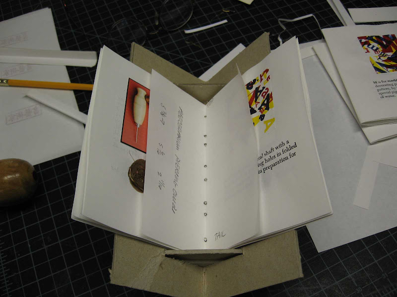 Piercing cradle with signature and piercing guide title=