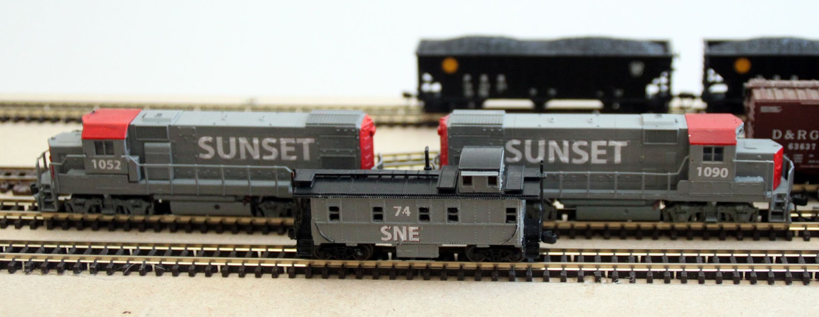 SNE loco and caboose roster in their new paint schemes Model Railroad