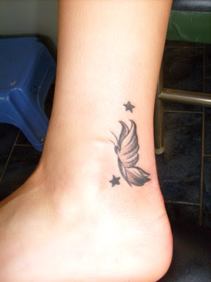 small butterfly tattoos on foot. butterfly tattoo gallery