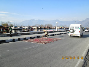 A Kasmiri Carpet being dried on "Dal Lake" main road.