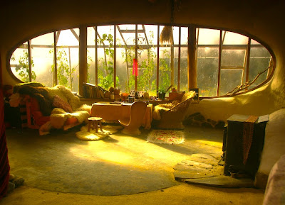 Wales hobbit house interior looking out at greenhouse