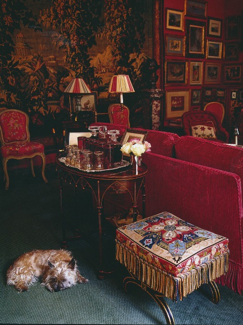 In the lush red salon of a home...