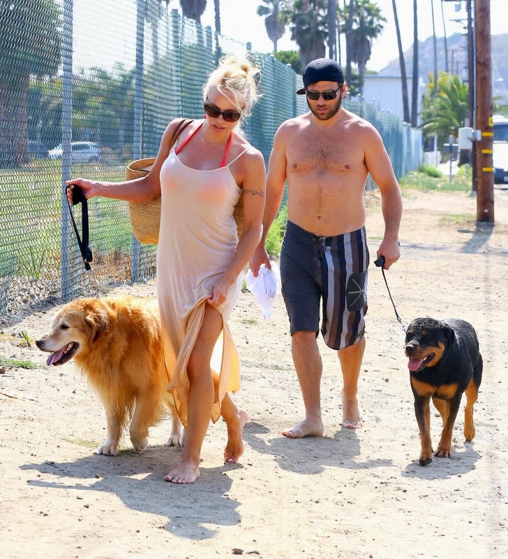 Pamela Anderson and Rick Salomon were spotted in Malibu, walking their dogs...