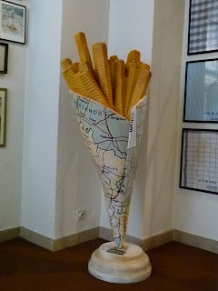 a sculpture of french fries in a paper cone