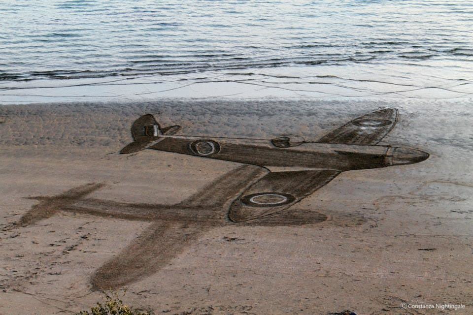 This 3-D plane even has it's own shadow, which is pretty spectacular. - They Went To Enjoy A Day At The Beach, But They NEVER Expected To See This. This 3-D plane even has it's own shadow, which is pretty spectacular. - They Went To Enjoy A Day At The Beach, But They NEVER Expected To See This.